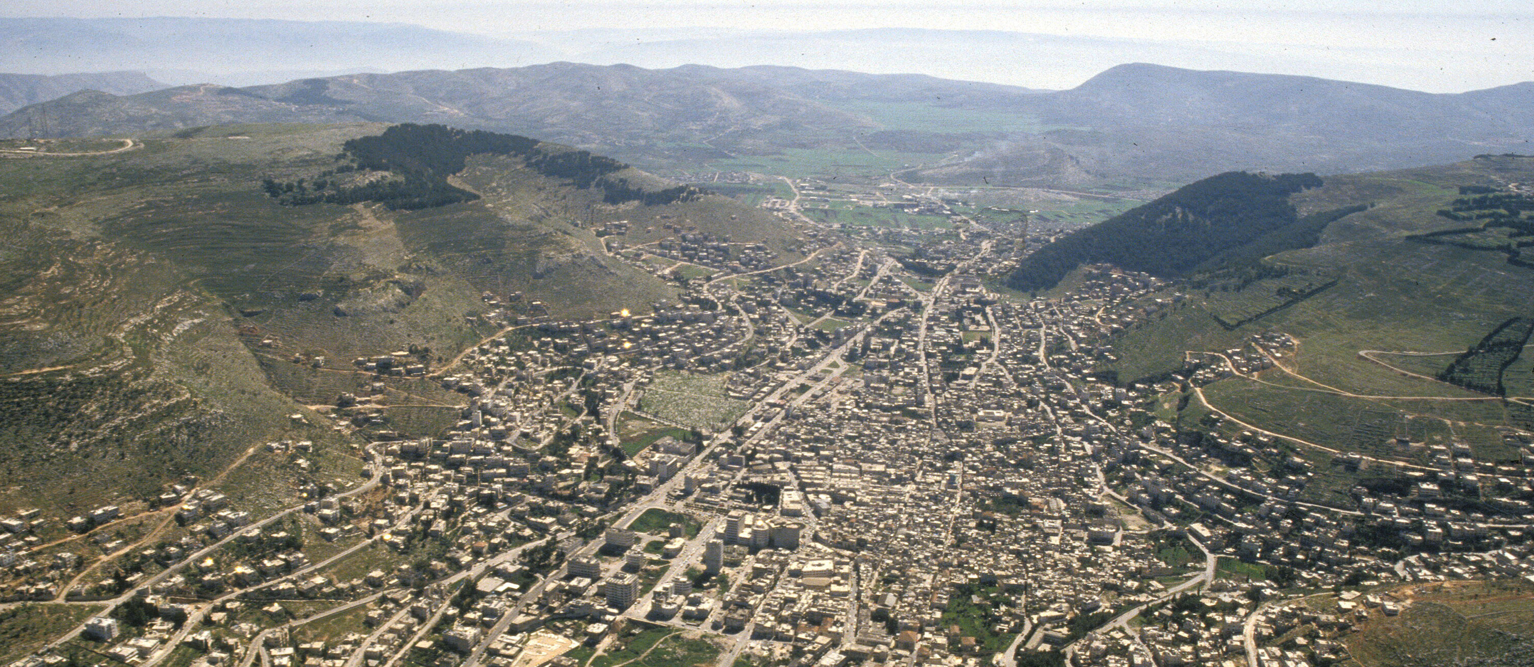 Aerial view of the city of Shechem (today's Nablus) with Mt Gerizim of the right and Mt Ebal on the left.